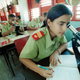 Yumara Borges, 15, and other students look through microscopes as they study at a laboratory November 26, 2001 at the School of the Army ‘Camilo Cienfuegos’ near Havana, Cuba.